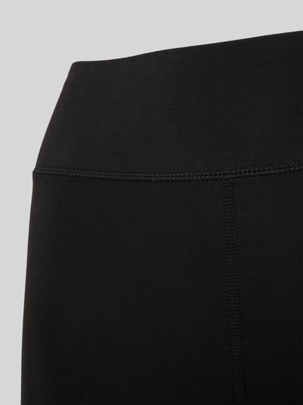 Productfoto, zwarte Leggings met elastische tailleband van Schiesser, model 'Invisible Soft Warming', zachte structuur, glad oppervlak.