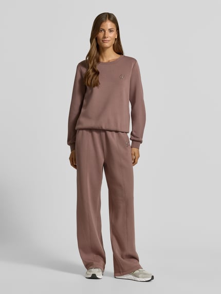 Vrouwenmodel draagt Relaxed Fit Sweatshirt uit viscosemix Model 'Felpa' van Liu Jo met siersteentjes, elastische boordjes, in bruin, Dames sweatshirt van Liu Jo Sport, geheel lichaam voorkant
