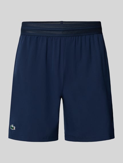 Produktfoto, Loose Fit Sport-Shorts mit Mesh-Bund von Lacoste, Optik: Unifarben, Logo-Stitching, elastischer Mesh-Bund, seitliche Eingrifftaschen