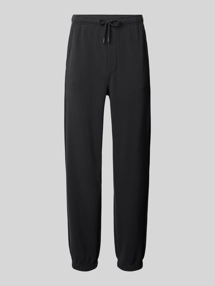 Produktfoto, Sweatpants mit Eingrifftaschen Modell 'ATUBAY' von American Vintage, Baumwoll-Elasthan-Mix, Relaxed-Fit, elastischer Bund, Tunnelzug, schwarz, glatte Textur, Herren, Innenbeinlänge bei Größe M/L: 77 cm