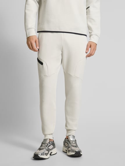 Under Armour Spodnie dresowe z elastycznym ściągaczem Złamany biały 4
