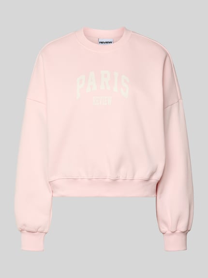 Productfoto, Sweatshirt met Label-Print en ronde hals van Review, lichtroze katoenmix, Relaxed Fit, witte tekst, gladde textuur.