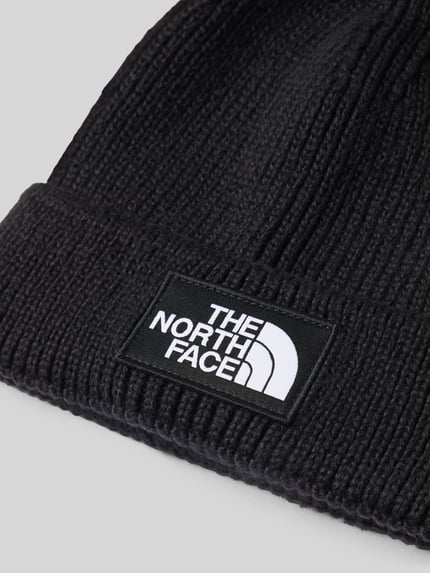 Produktfoto, Beanie in Ripp-Optik von The North Face in Schwarz mit breitem Umschlag, Strick-Optik und Label-Patch, elastischer Material-Mix
