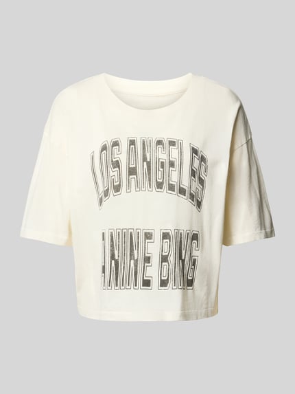 Produktfoto, Cropped T-Shirt mit Label-Print von Anine Bing aus reiner Baumwolle in Offwhite, lockere Passform, Label-Print vorne