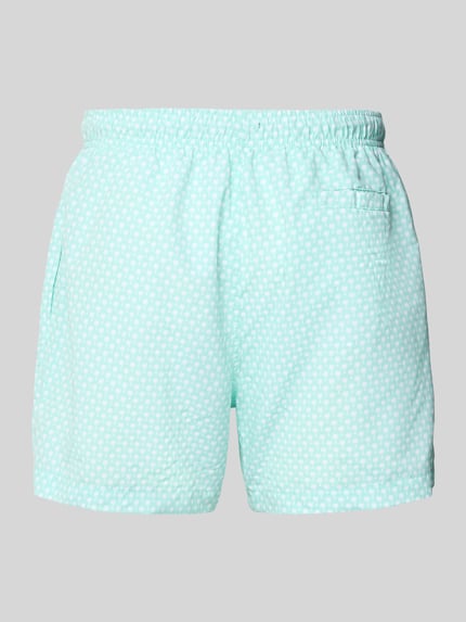 Produktfoto, spodenki kąpielowe 'Badehose mit Gesäßleistentasche' od MCNEAL, krój loose fit, elastyczny pas z trokiem, wyhaftowane logo, z tyłu kieszeń z wypustką, jasny kolor, drobny wzór, lekko fakturowana powierzchnia