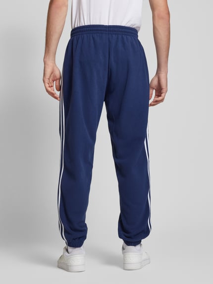 adidas Originals Spodnie dresowe z elastycznym ściągaczem Granatowy 5