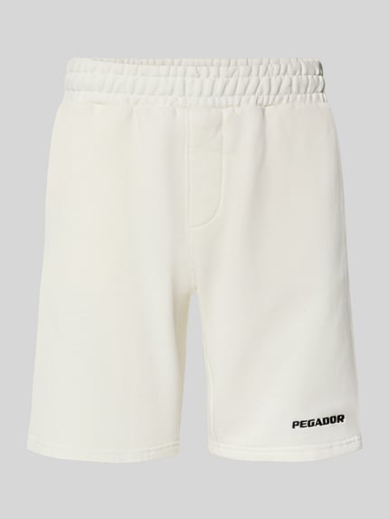 Produktfoto, Shorts mit elastischem Bund und Logo-Stitching von Pegador im Loose Fit aus Baumwoll-Mix in Weiß mit französischen Eingrifftaschen