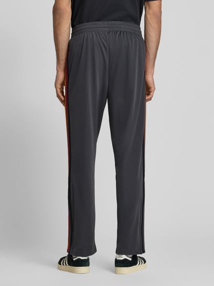 adidas Originals Spodnie dresowe o kroju relaxed fit z paskami z logo model 'FIREBIRD' Antracytowy 5