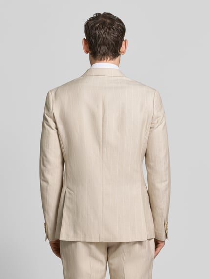 Männermodel trägt Regular Fit Sakko mit Pattentaschen und Reverskragen von MCNEAL, Material-Mix mit Leinen-Anteil, Rückenansicht.