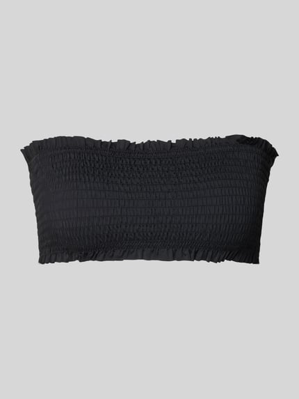 Produktfoto, schwarzes Bandeau-Top mit Smok-Details, Modell 'SKIN LOBSTER' von Neo Noir, Material-Mix mit Stretch-Anteil, körpernahe Passform
