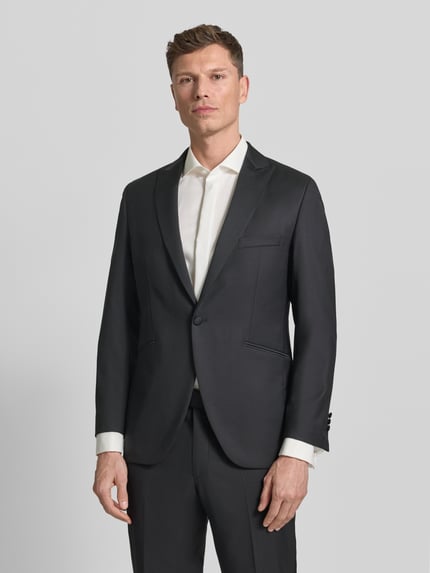 Männermodel trägt 1-Knopf-Sakko mit Reverskragen von Wilvorst, schwarzer Baumwoll-Mix, Regular Fit, Ganzkörperansicht von vorne