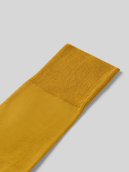 Produktfoto, Socken aus elastischem Schurwolle-Mix mit Baumwoll-Anteil von FALKE Modell 'AIRPORT', prążkowany ściągacz, Z napisem z logo, kolor musztardowy, gładka tekstura