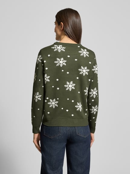 Männermodel trägt Strickpullover mit Rundhalsausschnitt Modell 'SNOWI' von Vila w zielonym kolorze, białe śnieżynki, dopasowany krój, widok z tyłu, Ganzkörperansicht Rückansicht.