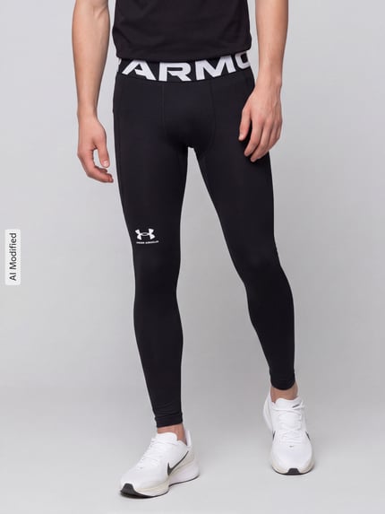 Männermodel trägt schwarze Slim Fit Sport-Leggings mit Logo-Print von Under Armour, glatte Textur, Ganzkörperansicht von vorne, KI-modifiziertes Bild.