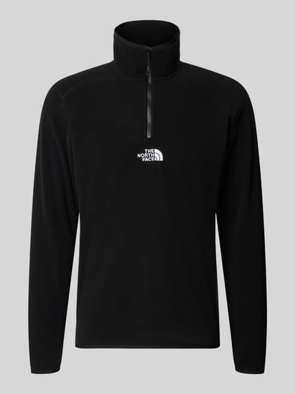 Produktfoto, Fleecepullover mit Label-Stitching von The North Face in Schwarz, Regular Fit, Stehkragen, Reißverschluss, weiche Textur