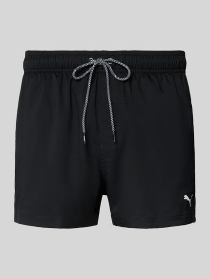 Produktfoto, Badehose mit Seitentaschen und Klettverschlusstasche hinten von PUMA in Schwarz, elastischer Bund, Regular Fit, glatte Textur