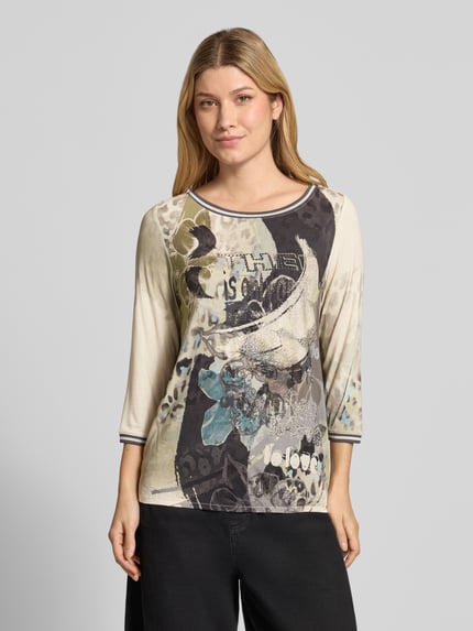 Frauenmodel trägt 3/4-Shirt mit elastischem Saumabschluss von BETTY BARCLAY, mehrfarbiges abstraktes florales Aquarellmuster, Jersey, Ganzkörperansicht von vorne.
