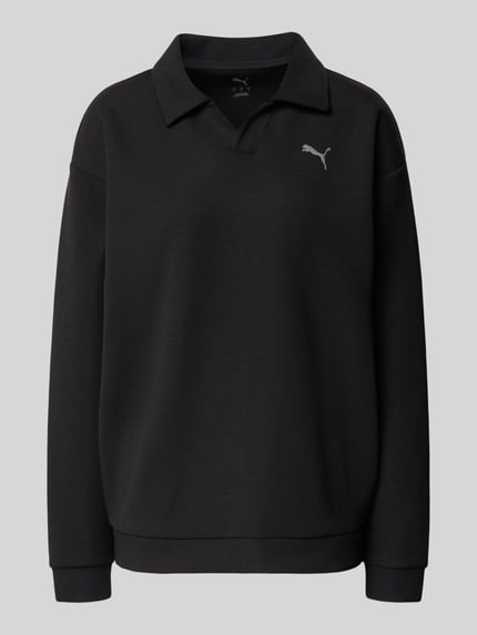 Produktfoto, Relaxed Fit Poloshirt mit Lyocell-Anteil von PUMA, elastyczna mieszanka materiałów, detal z logo, kołnierzyk polo, z długim rękawem, elastyczne wykończenia, kolor czarny, gładka struktura