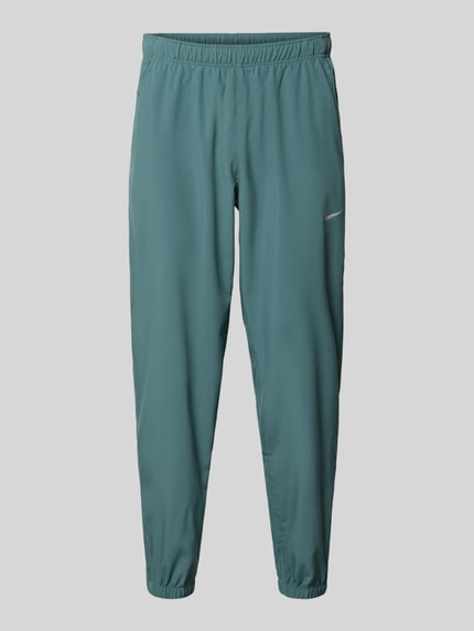 Productfoto, Form Pants met logoprint en steekzakken van NIKE TRAINING in groen, nauwsluitend model, elastische band, elastische boordjes