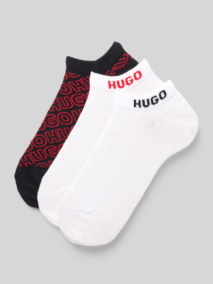 Produktfoto, trzy pary skarpet skarpety z mieszanki bawełny od HUGO, białe i czarne, widoczne logo, faktura gładka