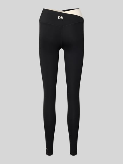 Produktfoto, High Rise Leggings in asymetrycznym kroju od P.E Nation, czarne, mieszanka materiałów z dodatkiem streczu, dopasowany krój, wysoki stan, pełna długość, elastyczny pas, damskie legginsy
