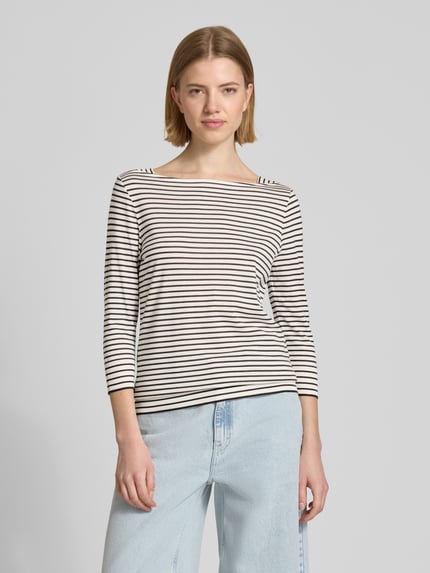 Kobiece modelka nosi Regular Fit Longsleeve aus Lyocell-Mix od Windsor, paski czarno-białe, 3/4 rękaw, krój regular fit, lyocell z bawełną, envelope-dekolt, długość pleców w rozmiarze 36: 59 cm, jasnoniebieskie spodnie, zdjęcie: z przodu, ujęcie całej sylwetki.