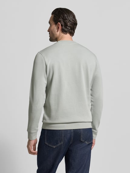 Mannelijk model draagt Relaxed Fit Sweatshirt uit zuivere katoen model 'WESTART' van BOSS Orange, effen, label patch, rugaanzicht