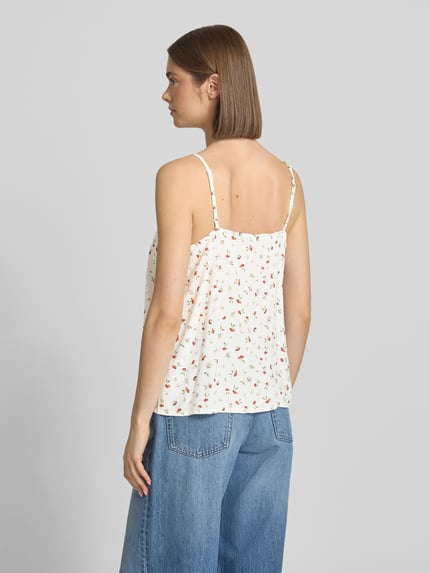 Frauenmodel trägt Regular Fit Blusentop aus reiner Viskose Modell 'NALA LIFE' von Only mit Allover-Muster, Rückansicht Ganzkörperansicht.