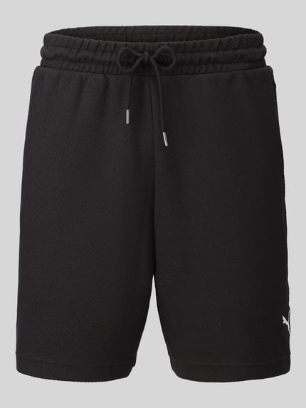 Produktfoto, schwarze Relaxed Fit Sweatshorts aus Baumwoll-Mix 'ESS ELEVATED' von PUMA, Herren Sweatshorts von PUMA Performance, glatte Struktur