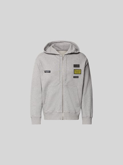 Produktfoto, Regular Fit Sweatjacke mit Logo-Patch von MM6 Maison Margiela aus czystej bawełny, kaptur ze sznurkiem, zamek błyskawiczny, długość tyłu w rozmiarze M 69 cm, szerokość ramion w rozmiarze M 45 cm, długość rękawa w rozmiarze M 72 cm, jasnoszary melanż, prosty krój, gładka tekstura