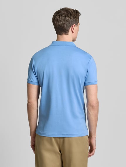 Męski model nosi Regular Fit Poloshirt aus reiner Baumwolle od Polo Ralph Lauren, kolor jednolity, krój regular fit, bawełna, całkowity widok z tyłu