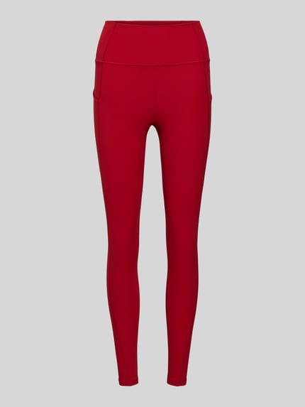 Produktfoto, Slim Fit Leggins met beenzakken model 'OASIS' van Fabletics, elastische mix, brede band, dames leggins, effen rood, glad oppervlak