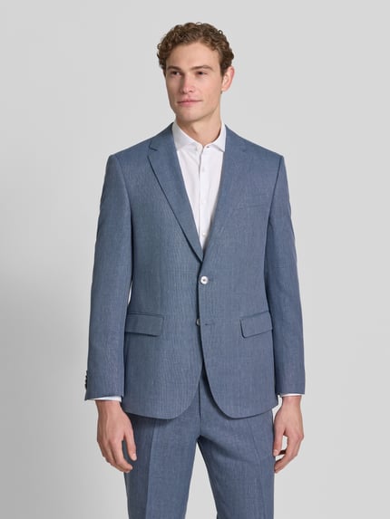 Männermodel trägt Regular Fit Anzugsakko aus Leinen-Mix Modell 'JASPER' von BOSS, melanż, kołnierz z połami, zapięcie na 2 guziki, kieszeń z patką, brystasza, kieszeń wewnętrzna, tkana faktura, mieszanka lnu, Ganzkörperansicht von vorne.