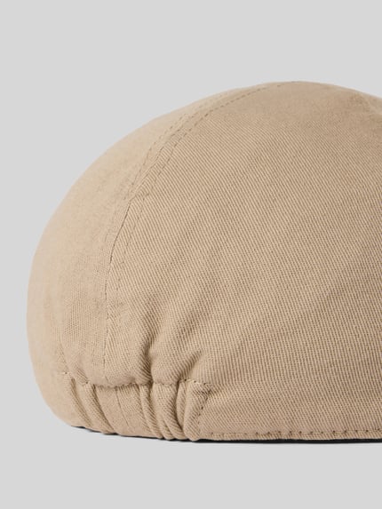 Produktfoto, Schiebermütze in Denim-Optik von Müller Headwear, beige Baumwolle mit abgerundeter Form und teilelastischem Bund, texturierte Oberfläche.