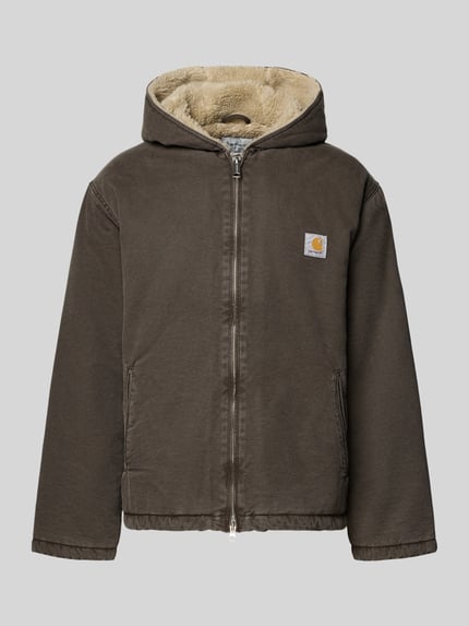 Produktfoto, braune Jacke mit Kapuze aus reiner Baumwolle, Zweiwege-Reißverschluss, Modell 'MITCH' von Carhartt Work In Progress, sichtbar angeraute Struktur, aufgesetzte Eingrifftaschen, Label-Detail vorne, Regular Fit