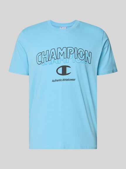 Produktfoto, T-Shirt mit Label-Print und Rundhalsausschnitt von CHAMPION aus reiner Baumwolle, Regular Fit, blau, weiche Textur, Frontansicht