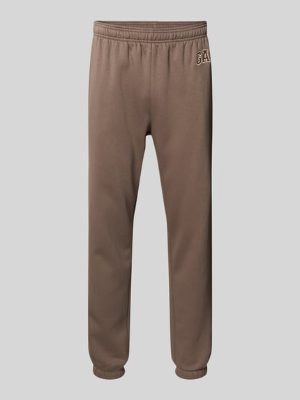 Produktfoto, Sweatpants mit Eingrifftaschen von GAP aus Baumwoll-Mix in Braun, Regular-Fit, elastischer Bund, Logo, leicht strukturierte Oberfläche.