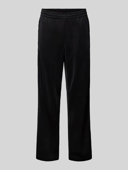 Produktfoto, czarne spodnie treningowe z elastycznym pasem, model 'FIREBIRD' od adidas Originals, regular fit, kieszenie na suwak
