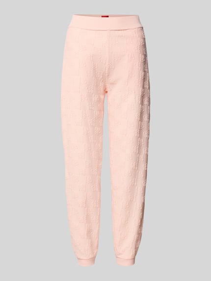Produktfoto, Slim Fit Sweatpants aus Baumwoll-Mix Modell 'TERRYMONOGRAM' von HUGO in zartem Rosa, Logo-Monogramm, unifarben, elastische Bündchen, seitliche Eingrifftaschen, Sweat-Textur