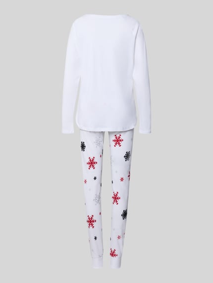 Vrouwenmodel draagt Pyjama uit pure katoen model 'Winterzauber' van LOUIS & LOUISA, wit met sneeuwvlokprint, elastische taille, context: dames pyjama, top los model, broek aansluitende fit, ronde hals, motiefprint met statement-stitching, pyjamabroek met elastische band, geheel beeld rugaanzicht.