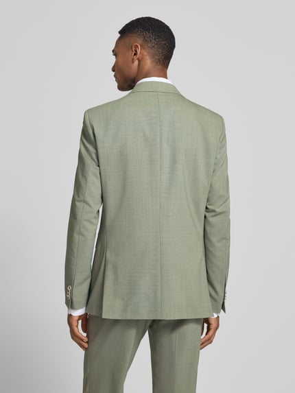 Męski model nosi Slim Fit 2-Knopf-Sakko mit Pattentaschen Modell 'Paul SV' von CG - Club of Gents w jasnoszarym kolorze, tkanina o gładkiej strukturze, widoczne klapy, krój slim fit, długość tyłu w rozmiarze 50: 77 cm, szerokość ramion w rozmiarze 50: 43 cm, długość rękawa w rozmiarze 50: 64 cm, całkowity widok z tyłu.