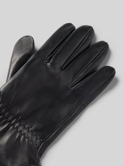 Produktfoto, Handschuhe aus echtem Leder mit kurzem Seitenschlitz von EEM, schwarze glatte Oberfläche, eingefasste Abschlüsse, Herren Accessoire.
