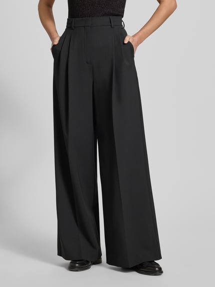 Frauenmodel trägt Regular Fit Weite Hose mit Schurwoll-Anteil Modell 'ASTA' von Weekend Max Mara, Optik: Unifarben, Materialverarbeitung: Webware, Label-Stitching-Applikation, Bundhöhe: High-Waist, Gürtelschlaufen, Schiebehaken und verdeckter Reißverschluss, seitliche Eingrifftaschen, Gesäßtaschen, Farbmix Dunkelgrau, Ganzkörperansicht von vorne.