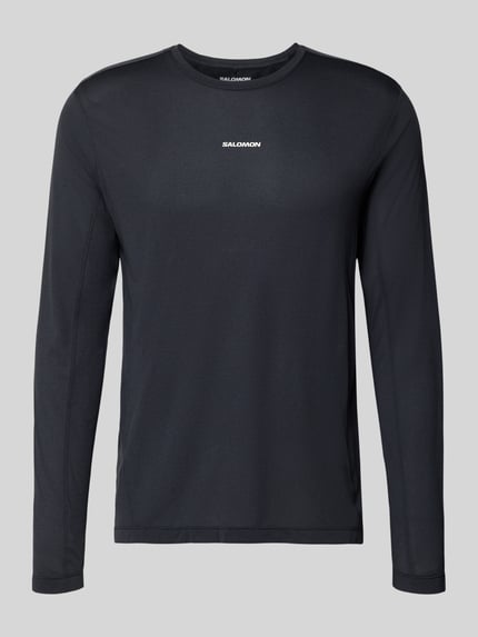 Produktfoto, czarne Funktionsshirt mit Logo und Rundhalsausschnitt von Salomon, krój regular fit, długi rękaw, długość tyłu w rozmiarze M: 70 cm
