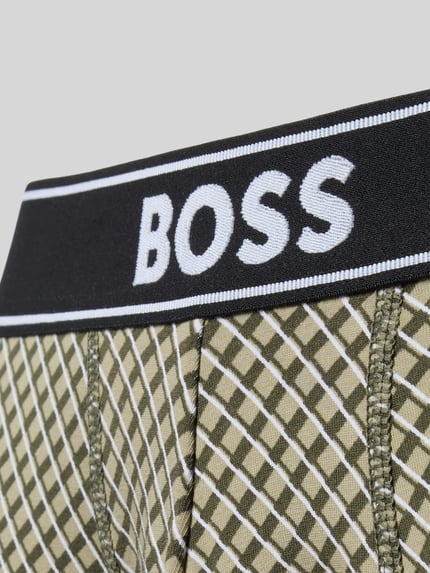 Produktfoto, Trunks aus Baumwoll-Mix von BOSS mit grün-beigem Karomuster und schwarzem Bund, Detailaufnahme. Herren Pant & Trunk von BOSS.