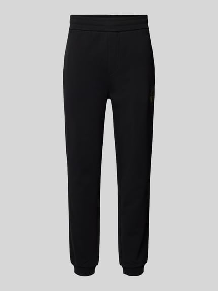Produktfoto, schwarze Oversized Jogginghose aus reiner Baumwolle Modell 'WEI_CNY' von BOSS, unifarben, Sweat-Material, seitliche Taschen, Label Print