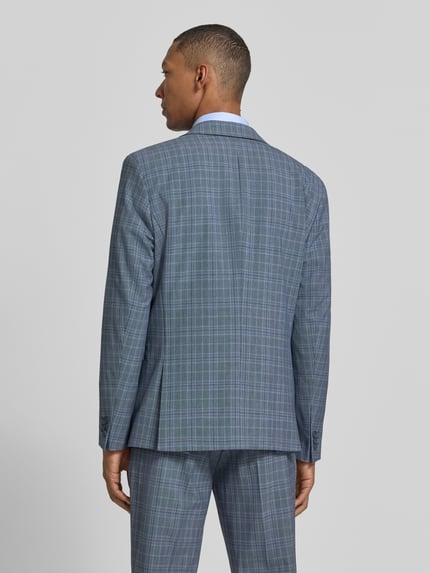 Männermodel trägt slim fit Slim Fit Sakko mit Brustleistentasche van Selected in gemêleerde look met fijn geweven motief, Ganzkörperansicht Rückansicht.