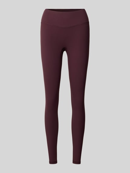 Produktfoto, schlanke, knöchellange Damen Slim Fit Leggins mit Logo-Detail Modell 'PURELUXE' von Fabletics in dunklem Rotton, glatte Struktur