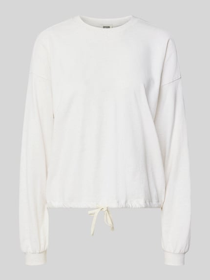 Produktfoto, Relaxed Fit Langarmshirt aus reine Baumwolle von DRYKORN, bluzka z długim rękawem z bawełny, krój relaxed fit, prążkowana plisa, tunel w dole, z długim rękawem, prążkowane ściągacze, kolor kremowy, jednolita struktura