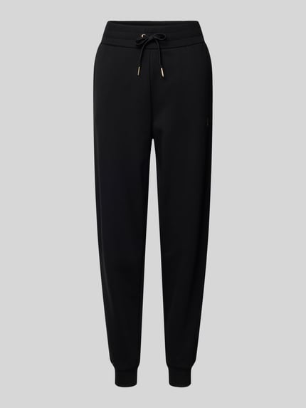 Produktfoto, czarne Sweatpants mit elastischem Bund von ARMANI EXCHANGE z bawełnianego mixu, luźny krój, kieszenie, nadruk z logo.